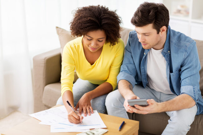 Family,Budget,,Finances,And,People,Concept,-,Couple,With,Papers