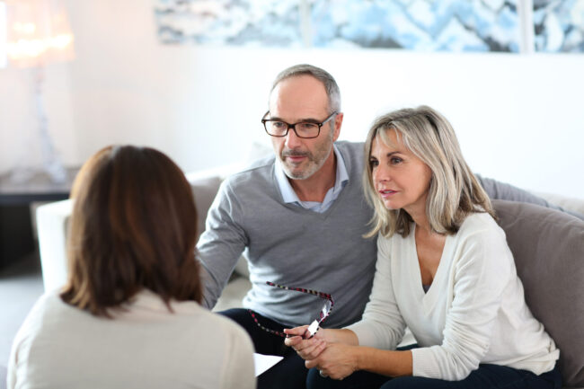 Senior,Couple,Meeting,Financial,Adviser,For,Investment