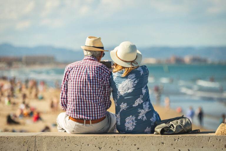 Mature,Couple,Of,Retired,Lovers,Enjoying,Retirement,On,The,Beach