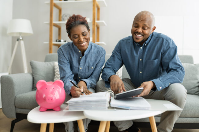 Happy,African,Couple,Doing,Retire,Finances,Plan,And,Money,Budget